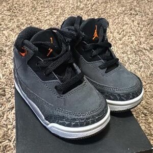 Jordan’s Kids Black and Orange Sneakers